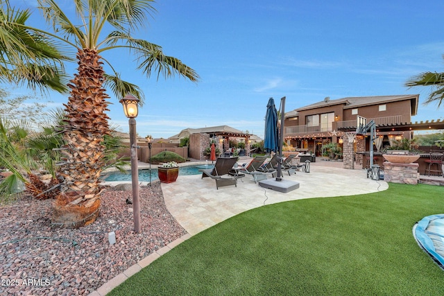 exterior space featuring a bar, a fenced in pool, a gazebo, and a patio