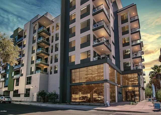 view of outdoor building at dusk