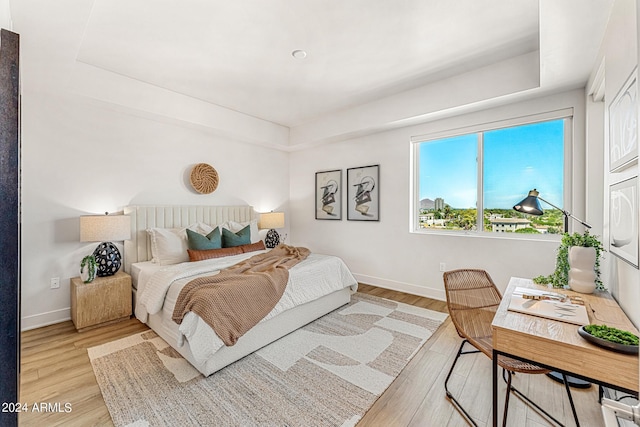 bedroom with light hardwood / wood-style flooring