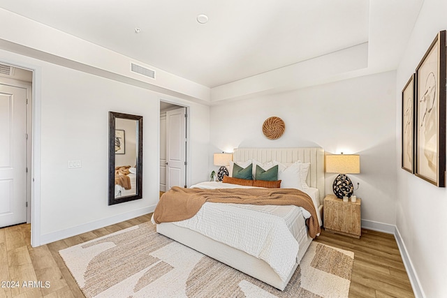 bedroom with light hardwood / wood-style flooring