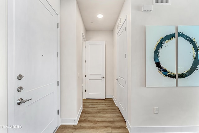 hallway featuring light hardwood / wood-style flooring