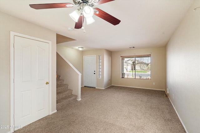 interior space featuring stairs, visible vents, and baseboards