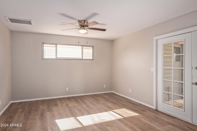 unfurnished room featuring ceiling fan and light wood-type flooring