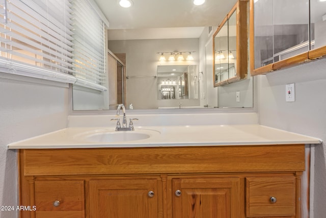 bathroom with vanity and walk in shower