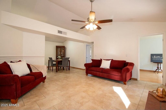 living room with ceiling fan and vaulted ceiling