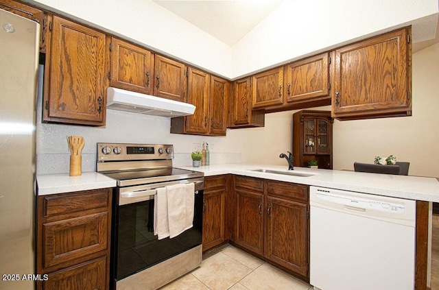 kitchen with stainless steel range with electric cooktop, light tile patterned floors, kitchen peninsula, dishwasher, and sink