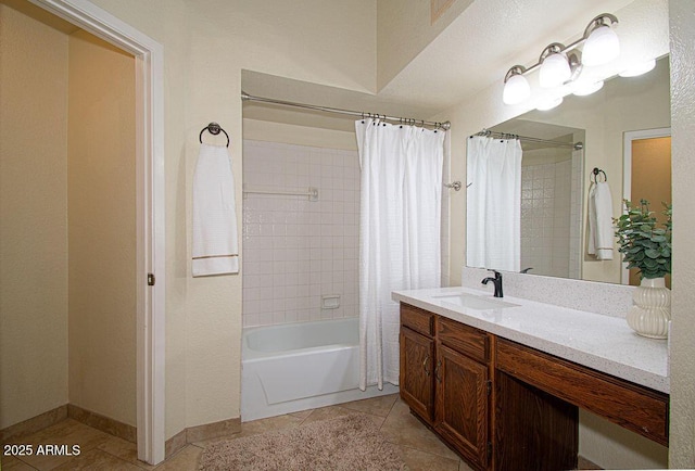 bathroom featuring shower / bath combo with shower curtain, tile patterned floors, and vanity