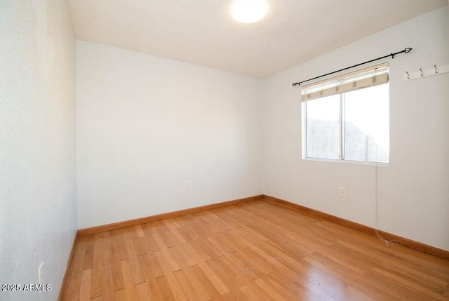 empty room with light hardwood / wood-style floors