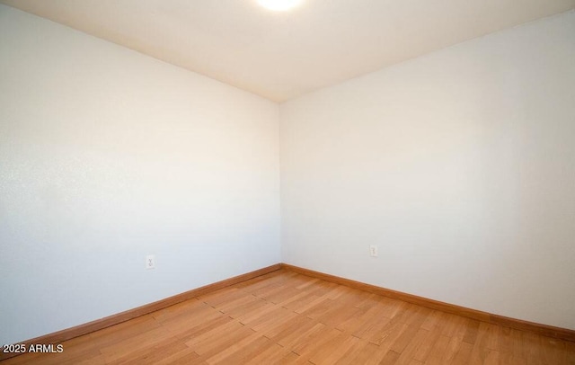 unfurnished room with light wood-type flooring