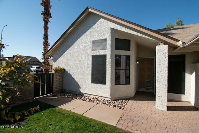 view of property exterior featuring a patio