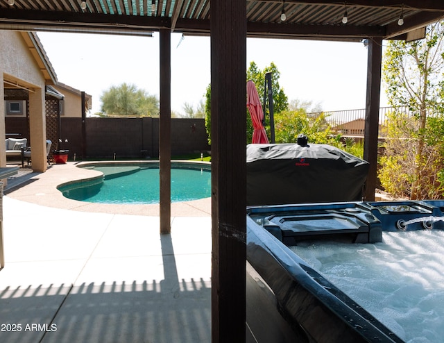 view of swimming pool featuring a fenced backyard, a fenced in pool, and a patio