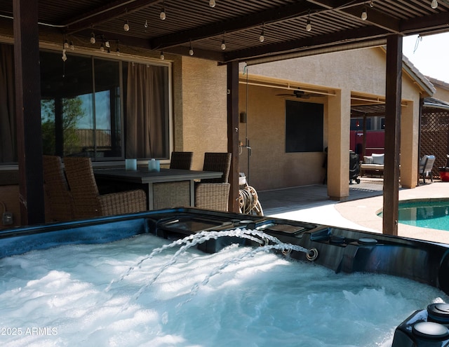 outdoor pool featuring outdoor dining area, a patio, and a hot tub