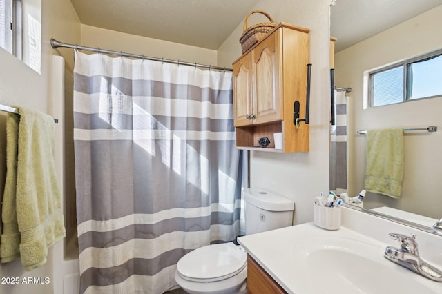 bathroom with vanity, toilet, and a shower with curtain