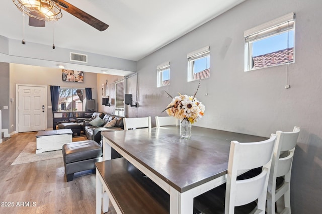 dining space featuring hardwood / wood-style flooring, plenty of natural light, and ceiling fan