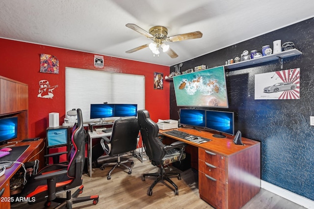 office with wood-type flooring and ceiling fan