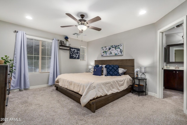 bedroom featuring baseboards, visible vents, carpet floors, recessed lighting, and a sink