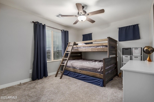 bedroom featuring a ceiling fan, carpet, and baseboards