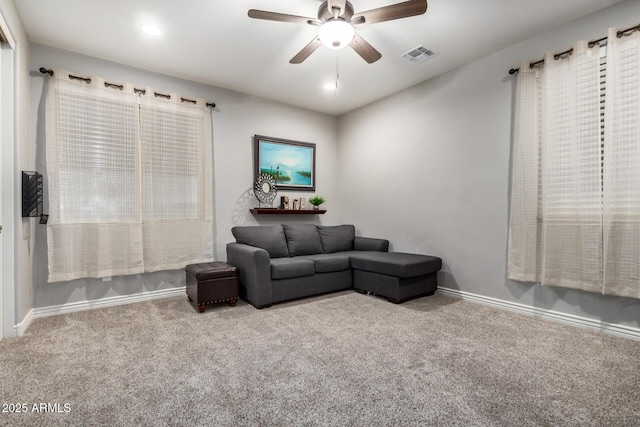 carpeted living area featuring recessed lighting, baseboards, visible vents, and ceiling fan