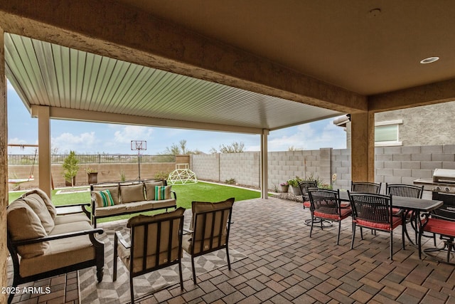 view of patio featuring outdoor dining space, an outdoor living space, a grill, and a fenced backyard