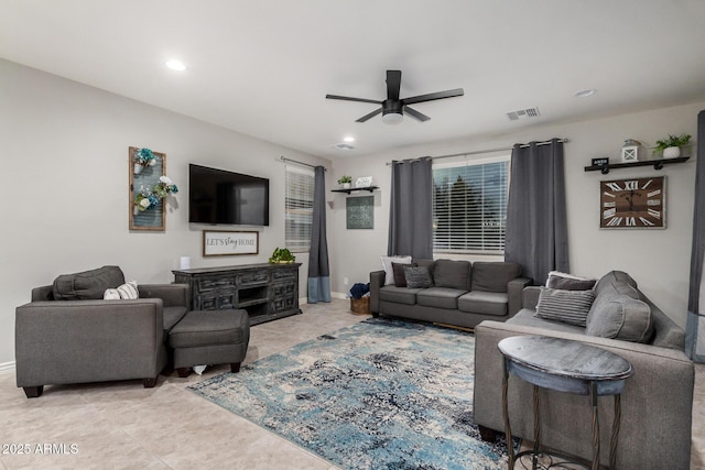 living area featuring light tile patterned floors, baseboards, visible vents, recessed lighting, and ceiling fan