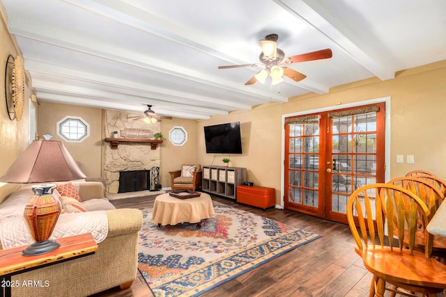 3377 W Grandview Rd, Phoenix, AZ 85053 - living area featuring ceiling fan, beam ceiling, a fireplace, wood-type flooring, and french doors