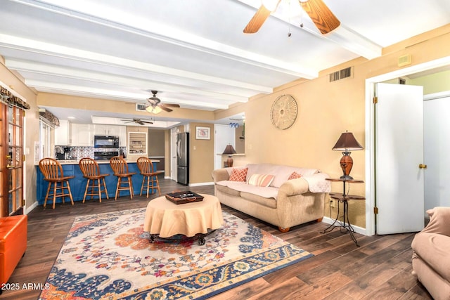 3377 W Grandview Rd, Phoenix, AZ 85053 - living area with dark wood-style flooring, a ceiling fan, baseboards, beamed ceiling, and visible vents