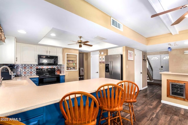 3377 W Grandview Rd, Phoenix, AZ 85053 - kitchen with a ceiling fan, visible vents, a sink, a raised ceiling, and black appliances