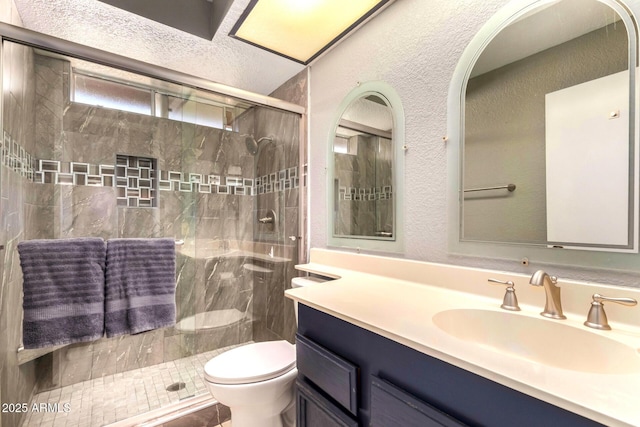 3377 W Grandview Rd, Phoenix, AZ 85053 - bathroom featuring vanity, a textured wall, toilet, and a shower stall