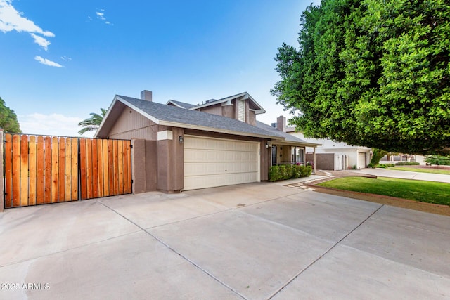 3377 W Grandview Rd, Phoenix, AZ 85053 - view of front of house featuring fence, an attached garage, driveway, and a chimney