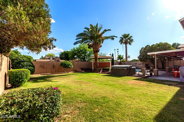3377 W Grandview Rd, Phoenix, AZ 85053 - view of yard with a fenced backyard, a hot tub, and a patio area