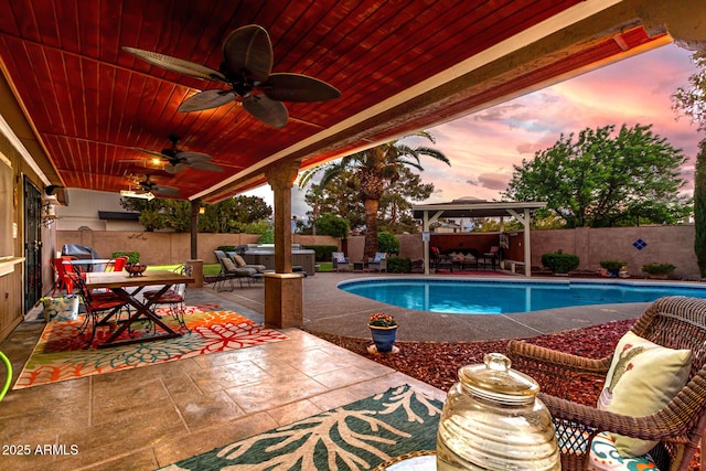 3377 W Grandview Rd, Phoenix, AZ 85053 - view of swimming pool with a ceiling fan, a gazebo, a fenced backyard, an outdoor hangout area, and outdoor dining space
