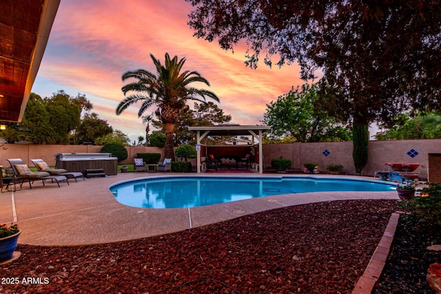 3377 W Grandview Rd, Phoenix, AZ 85053 - pool at dusk featuring a hot tub, a gazebo, a fenced backyard, and a patio area