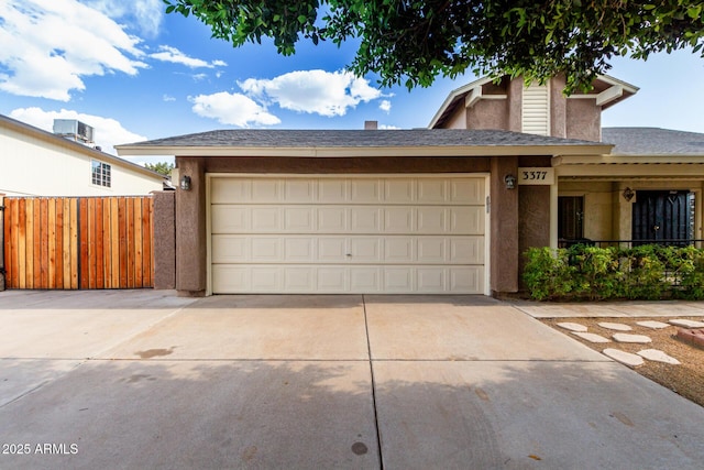 3377 W Grandview Rd, Phoenix, AZ 85053 - view of front of house featuring driveway, fence, an attached garage, a shingled roof, and stucco siding