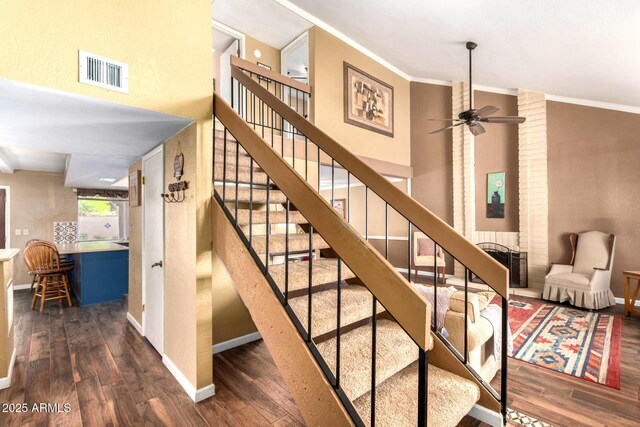 3377 W Grandview Rd, Phoenix, AZ 85053 - stairway with a ceiling fan, visible vents, crown molding, wood finished floors, and baseboards