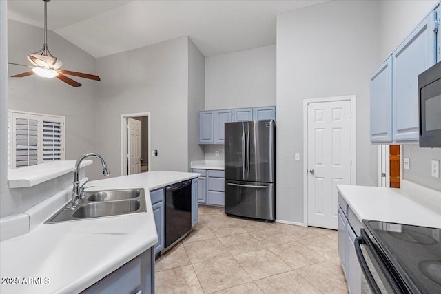 kitchen with ceiling fan, high vaulted ceiling, a sink, light countertops, and black appliances