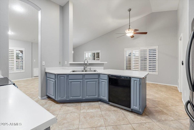 kitchen featuring light tile patterned flooring, a peninsula, a sink, black dishwasher, and light countertops