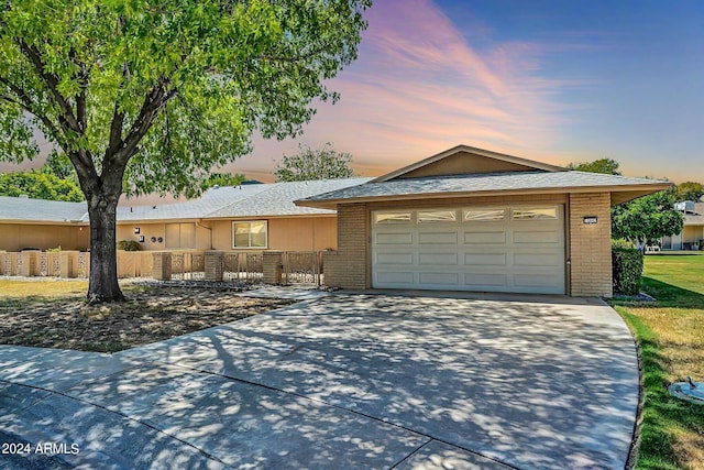 ranch-style home featuring a garage