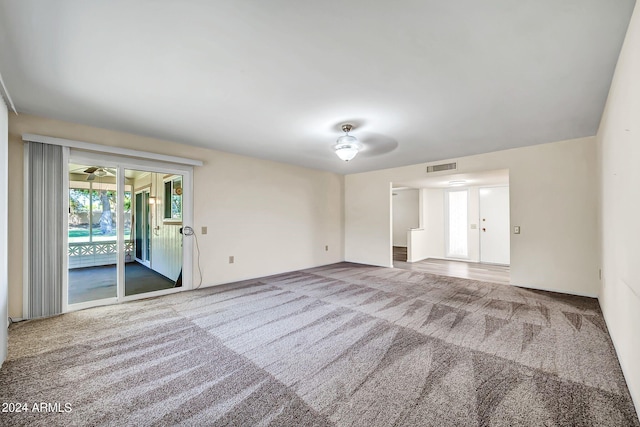 carpeted empty room with ceiling fan