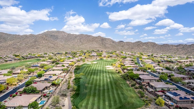 birds eye view of property featuring view of golf course, a residential view, and a mountain view