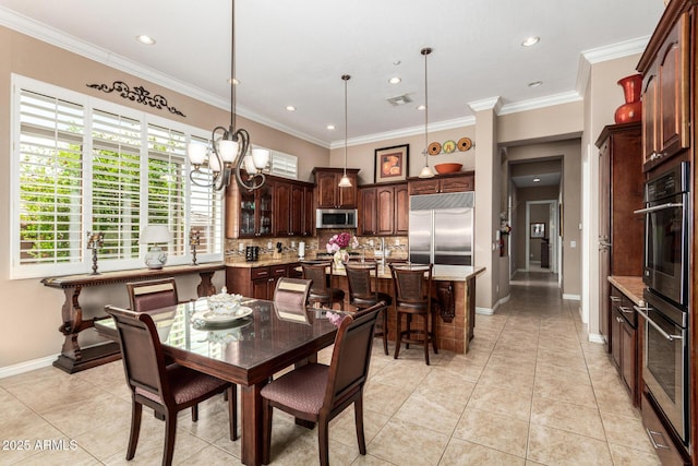 dining space featuring crown molding, baseboards, a notable chandelier, recessed lighting, and light tile patterned flooring
