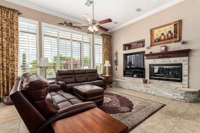 living area featuring tile patterned flooring, ornamental molding, ceiling fan, and visible vents