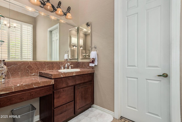 bathroom featuring vanity and a notable chandelier
