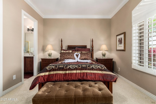 bedroom with carpet floors, crown molding, baseboards, and ensuite bathroom