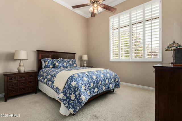 carpeted bedroom with a ceiling fan, baseboards, and ornamental molding