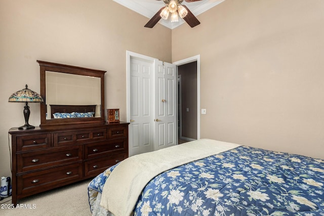 bedroom featuring crown molding, a ceiling fan, and light carpet