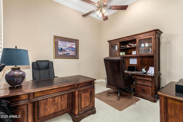 office featuring carpet flooring, a ceiling fan, and ornamental molding