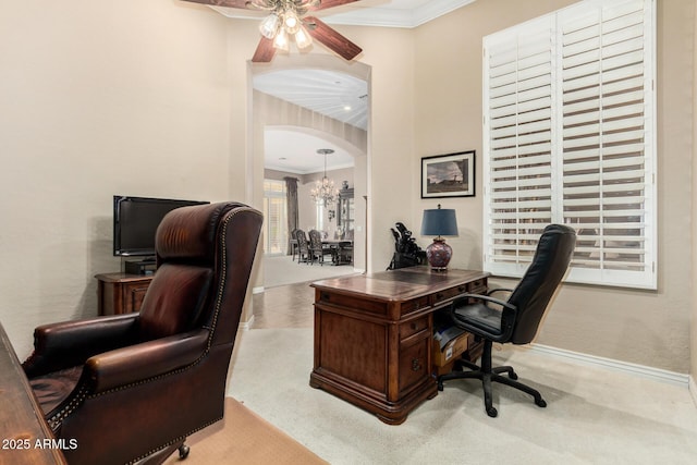 office with crown molding, arched walkways, baseboards, and ceiling fan with notable chandelier