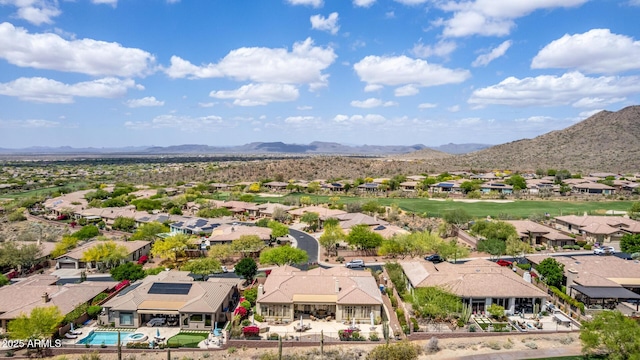 drone / aerial view featuring a residential view and a mountain view