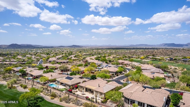 birds eye view of property with a mountain view and a residential view