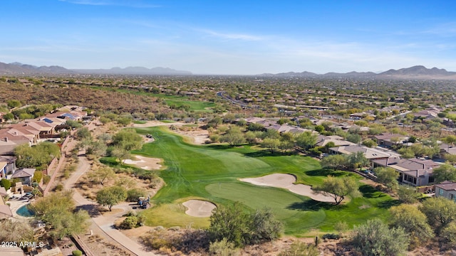 birds eye view of property with view of golf course, a residential view, and a mountain view